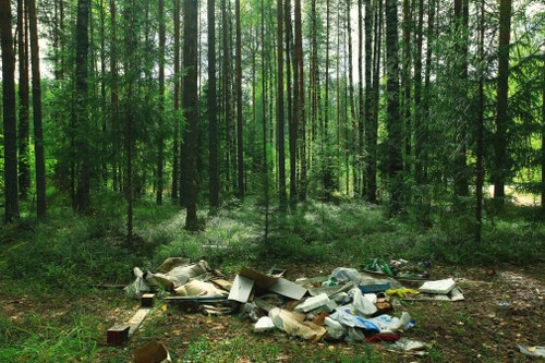 Workers removing timber and wood scraps